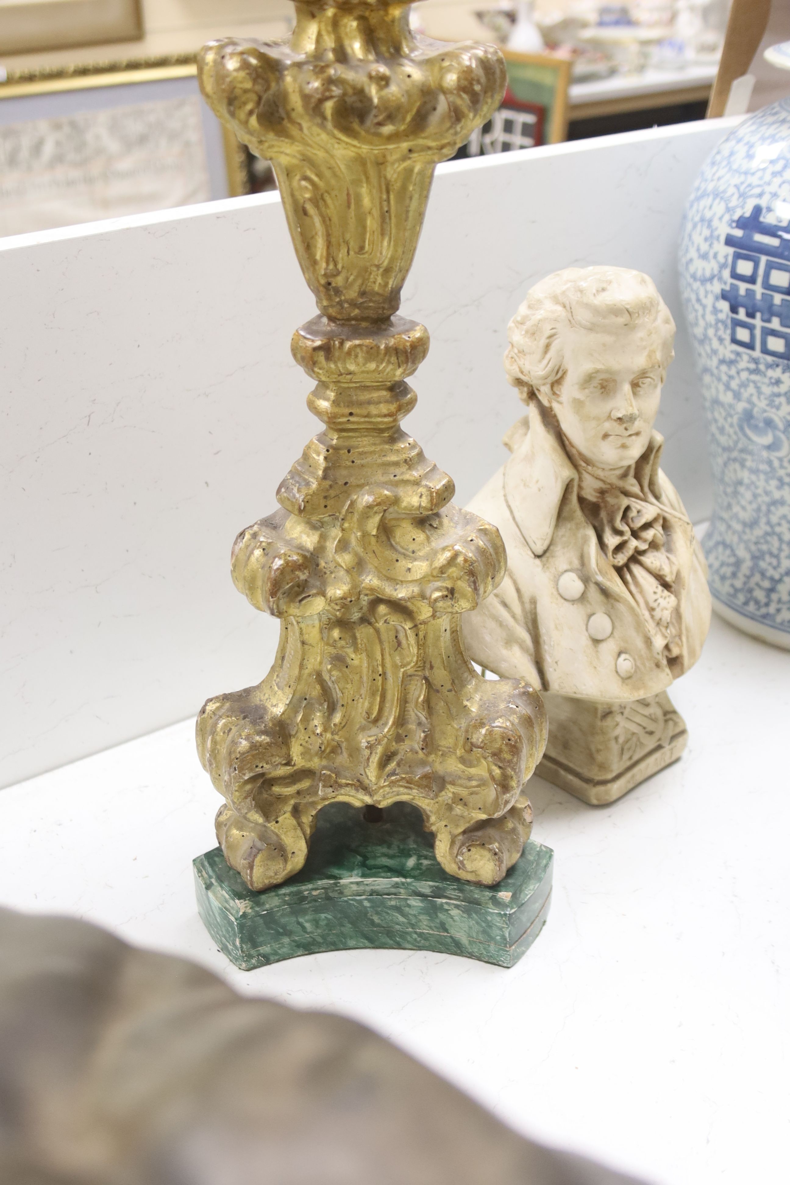 A giltwood altar candlestick as a lamp, height 71cm (excl. light fitting) and a plaster bust of Mozart